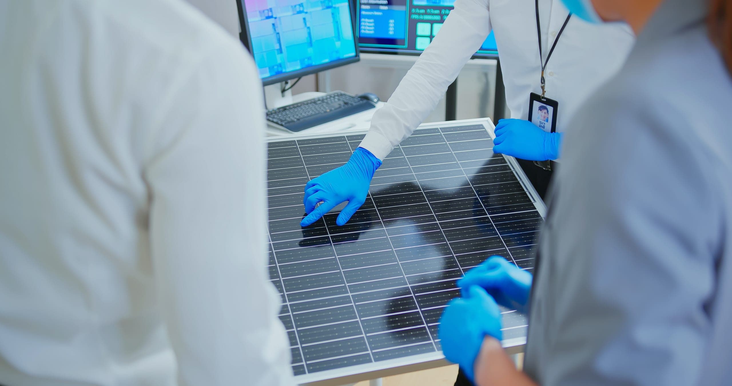 Solar panels and photovoltaic equipment in a utility-scale testing and compliance laboratory.
